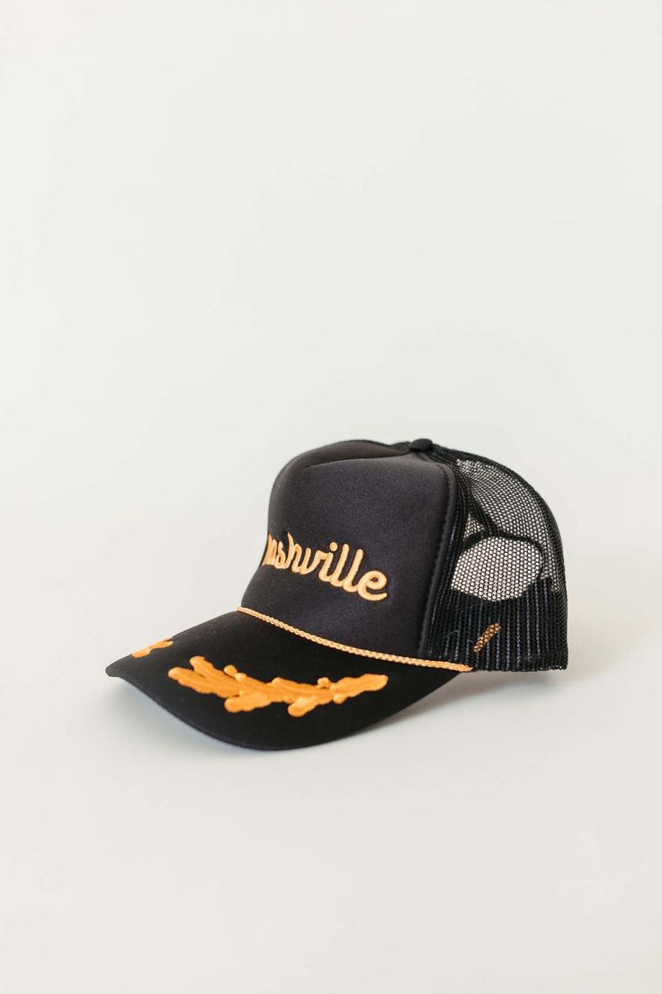 The Nashville Trucker Hat features a foam hat with embroidery, mesh back with an adjustable snap back. 100% Polyester Front 100% Polyester Mesh Back Not Eligible to Return Adjustable Hat For Streetwear And Baseball Season, Trucker Baseball Cap With Flat Brim For Baseball Season, Black Trucker Hat With Curved Brim For Streetwear, Trucker Baseball Cap With Flat Brim For Streetwear, Black Trucker Dad Hat With Curved Bill, Adjustable Baseball Trucker Hat, Urban Trucker Hat For Streetwear, Adjustable Trucker Cap, Urban Style Summer Trucker Hat