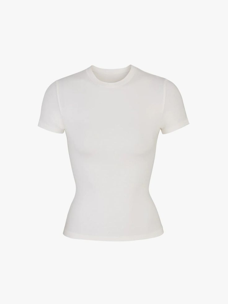 The 36 Best White T-shirts for Women, According to “Vogue” Editors | Vogue Skims Basic Tee, Skims Smoothing Tshirt, Skims Soft Smoothing T Shirt, Skims Tee Shirt, Basic White Shirt, Light Yoga, Expect Nothing, Estilo Hippy, Tshirt Outfits