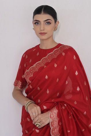 Red saree crafted in moonga silk with gold toned mughal flora vine woven detail along the scallop border and damask butti detail. Paired with a matching half sleeves closed round neck blouse. - Aza Fashions Saree With Full Sleeves, Red Banarasi Saree, Full Sleeves Blouse, Round Neck Blouse, Scallop Border, Red Saree, Sleeves Blouse, Banarasi Saree, Blouse For Women