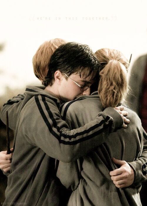 two people hugging each other in the middle of a movie poster for harry potter and the goblet of fire