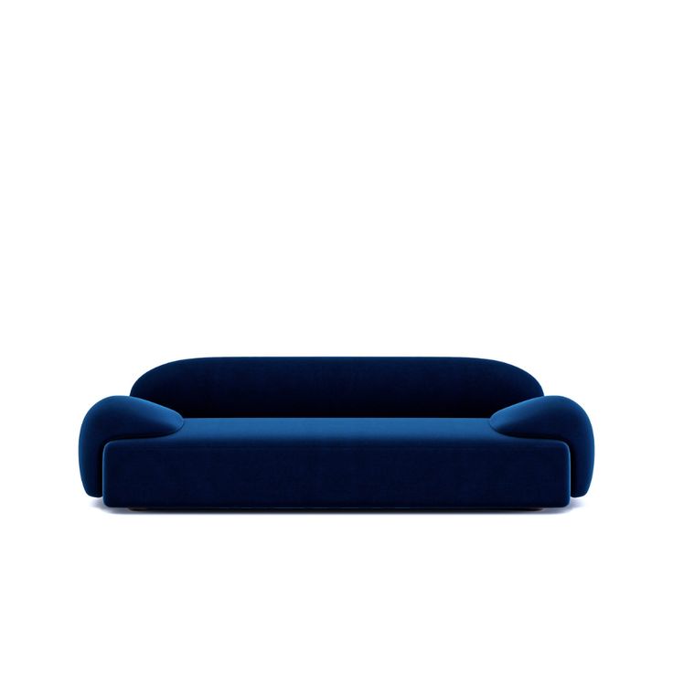 a blue couch sitting on top of a white floor