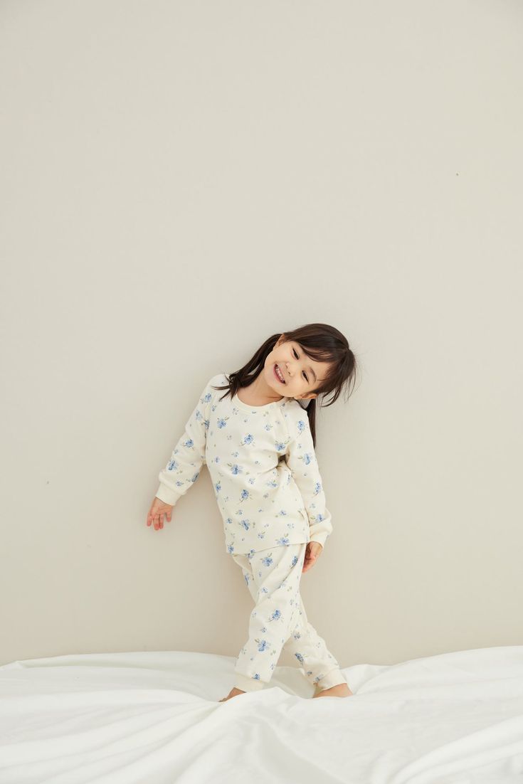 Pajama sets come with ultra-soft organic cotton, with a long-sleeve top and bottom. Two snap buttons at the front for easy pulling on. Featuring a neutral pattern print. The essential comfy and healthy apparel for kids to wear at home. -Made of 100% GOTS-Certified organic cotton -Color: Blueberry Pajamas Photoshoot, Kids Bedtime Routine, Christmas Gift For Kids, Sleep Time, Kids Bedtime, Toddler Pajamas, Romper And Jacket, Pajama Dress, Garden Print