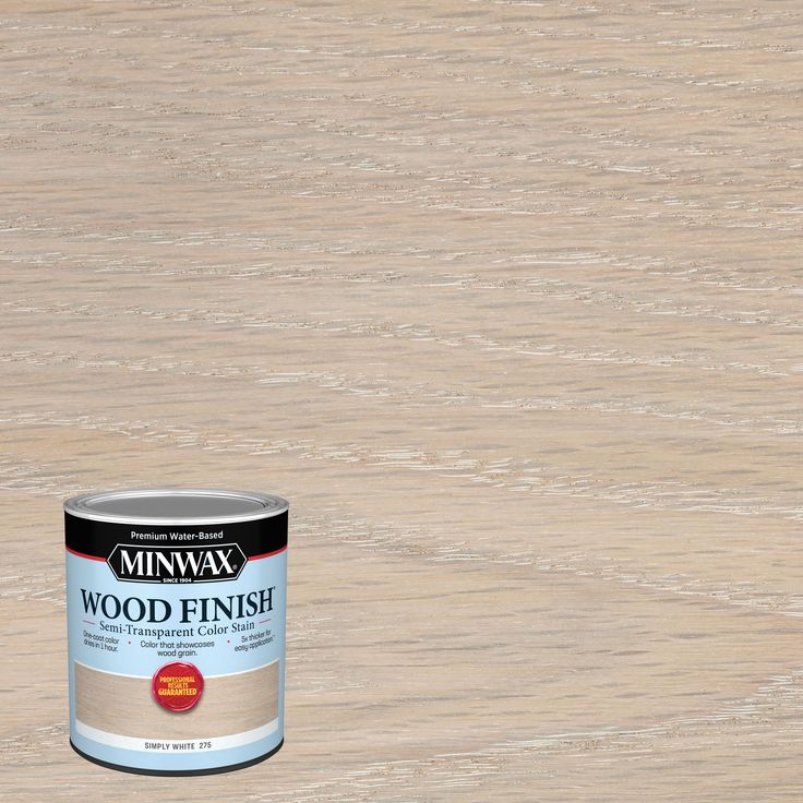 a can of wood finish sitting on top of a wooden floor