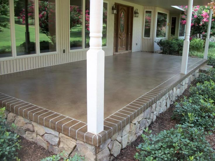 the front porch is covered with concrete