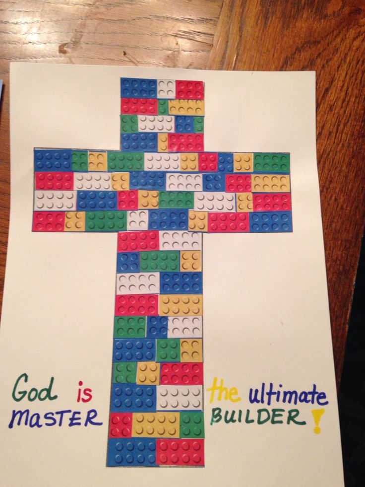 a cross made out of legos with the words god is the ultimate builder