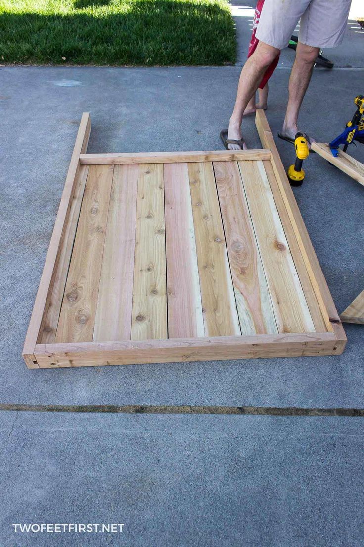 a man is working on some wood planks