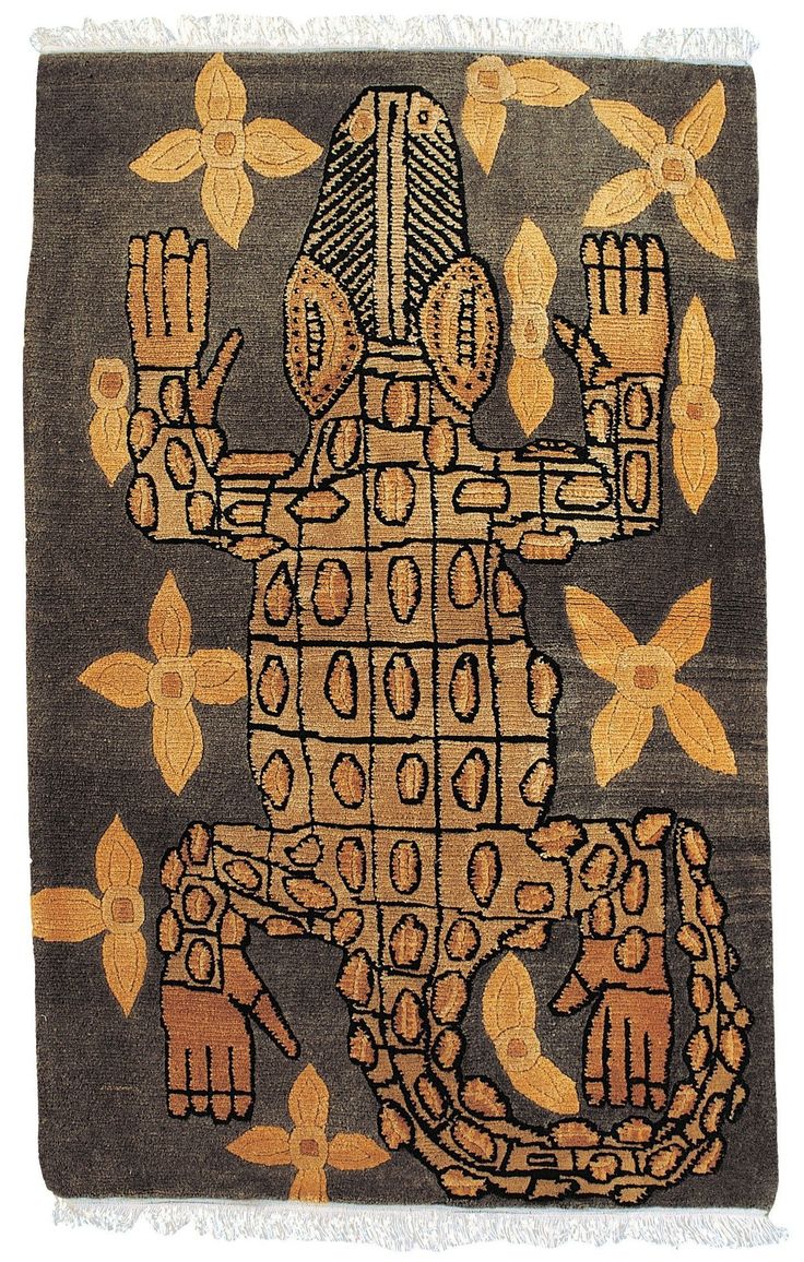 an old rug with a monkey on it's face and hands in the middle