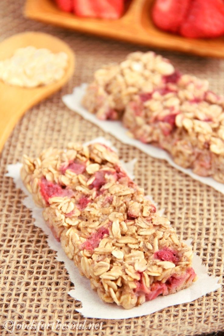 granola bars with strawberries and yogurt on the side