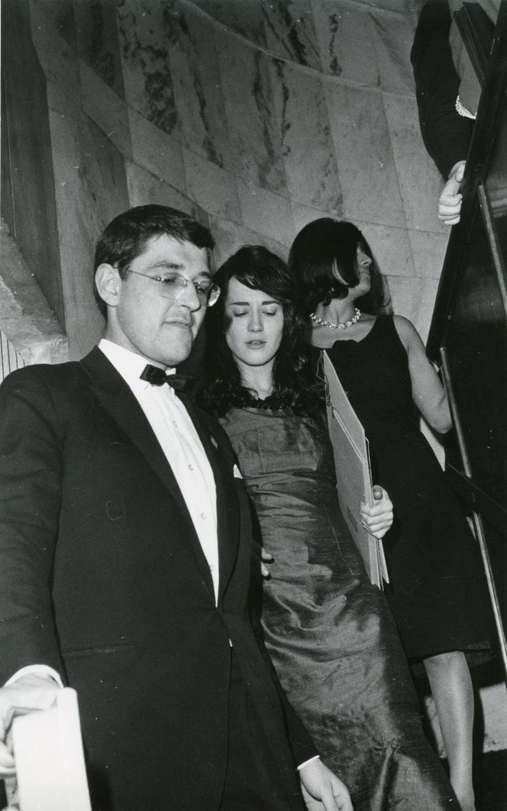 black and white photograph of two people in formal wear