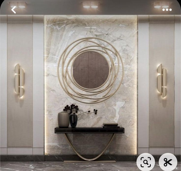 an elegant bathroom with marble walls and flooring is featured in this image, there are two vases on the console