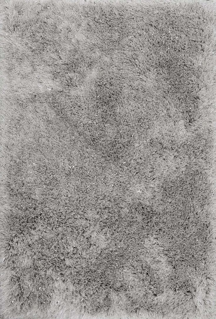 a gray area rug that looks like it has been made out of shaggyy material