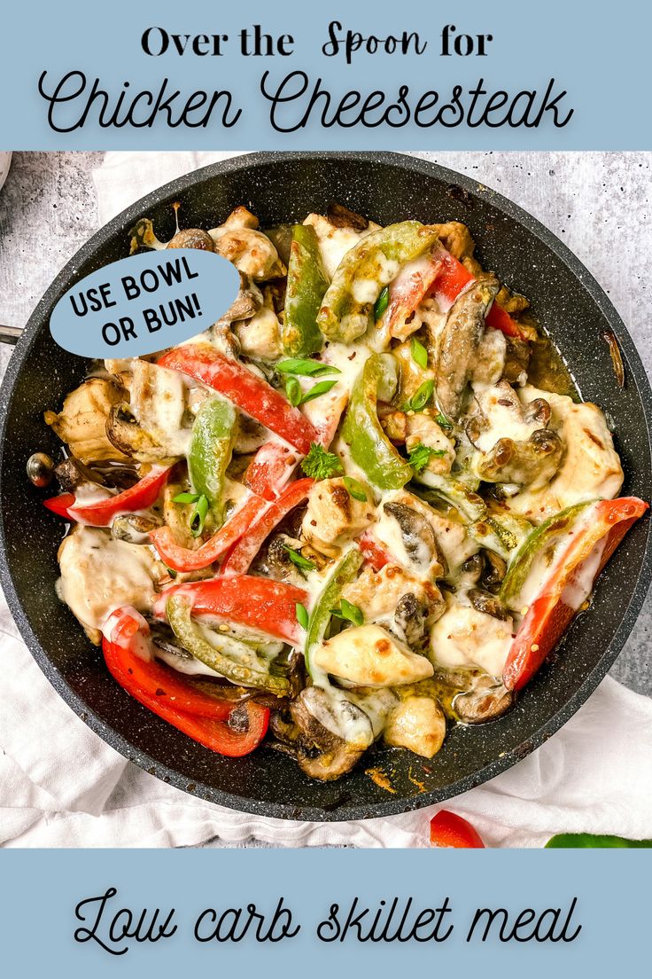 a skillet filled with chicken and vegetables on top of a table