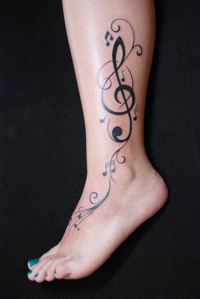 a woman's foot with musical notes on it