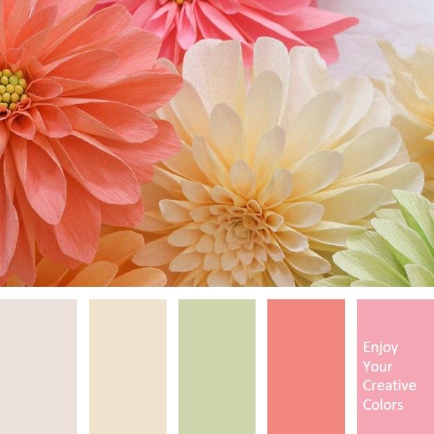 the color scheme is peach, green, and yellow with pink flowers in it's center