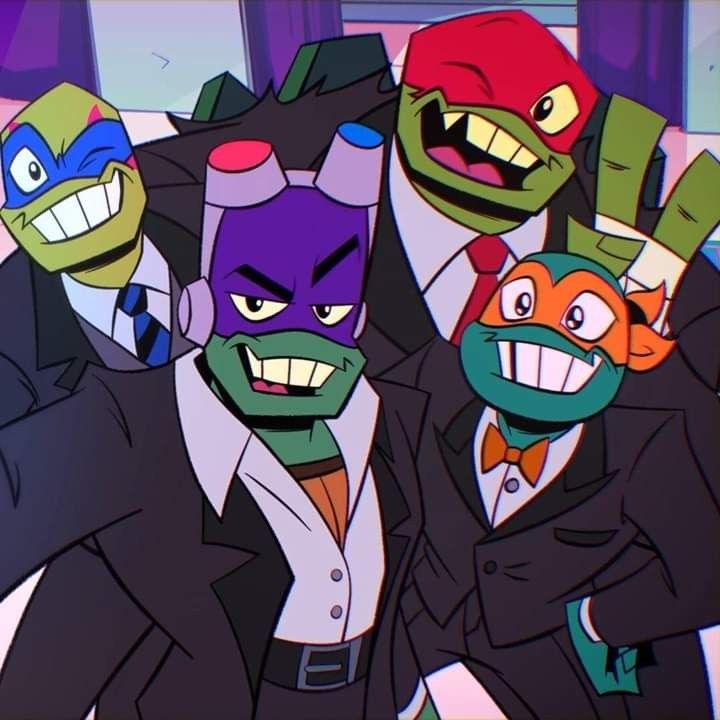 teenage mutant ninjas in suits and masks posing for a photo with their mouths open