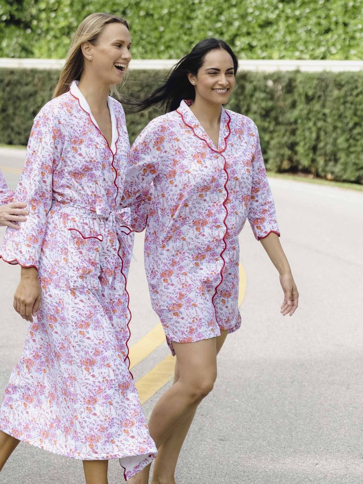 Getting dressed for bed is a stylish affair when you wear our pink floral nightshirt. Designed by Heidi and crafted in a custom floral pattern of pink watercolor botanicals, the nightshirt features three-quarter sleeves finished with a scalloped hem. Lightweight cotton offers the perfect level of warmth and comfort morning and night. ﻿This style is running small, please size up if needed Product Details Breathable, lightweight, and soft A slight A-line hem is a perfect length Painterly flower petals in pink are layered over a blue floral pattern for a chic contrast Red scalloped detail on the collar and cuffs adds a refined and finished touch 3/4-sleeve length Spacious side pockets to hold your phone and other necessities Button closures lay flat and keep the nightshirt closed 100% Cotton Watercolor Botanicals, Ski Print, Glamour Shots, Blue Hydrangea, Getting Dressed, Pink Watercolor, Night Shirt, Scalloped Hem, Flower Petals