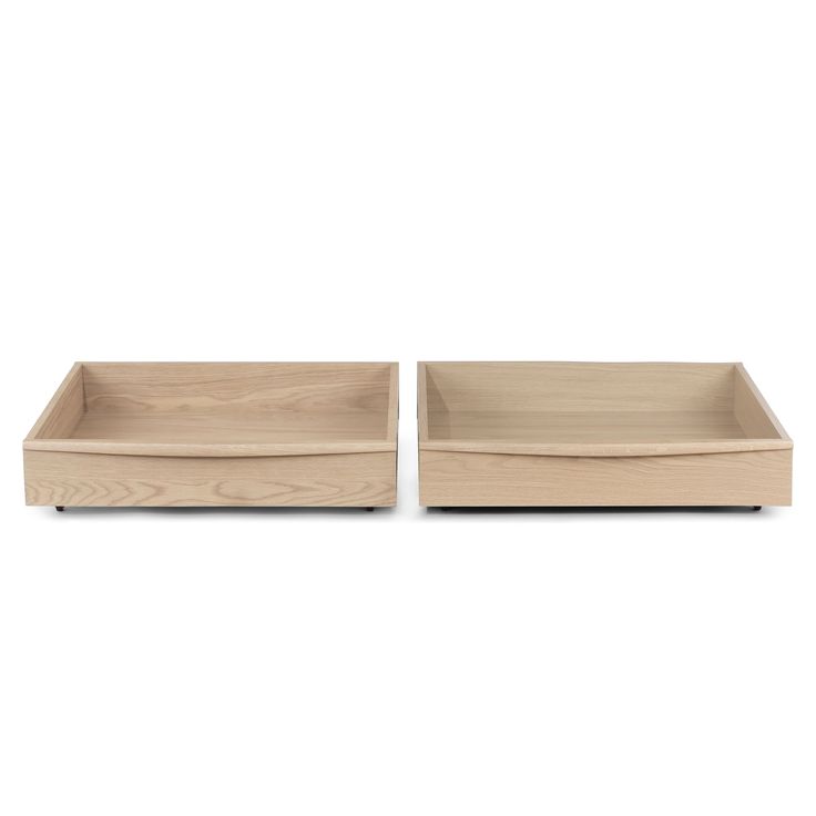 two wooden trays sitting on top of each other