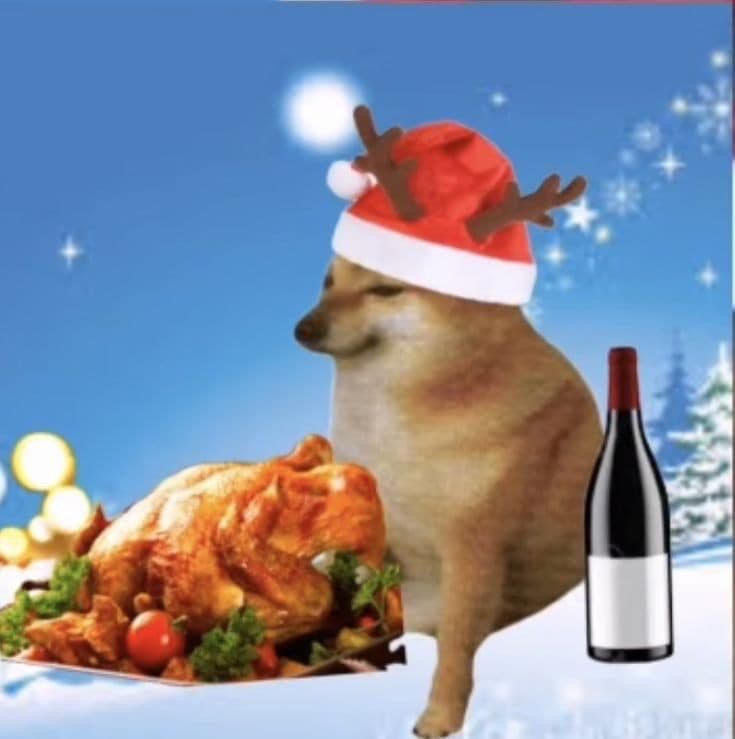 a dog wearing a santa claus hat next to a bottle of wine and a turkey