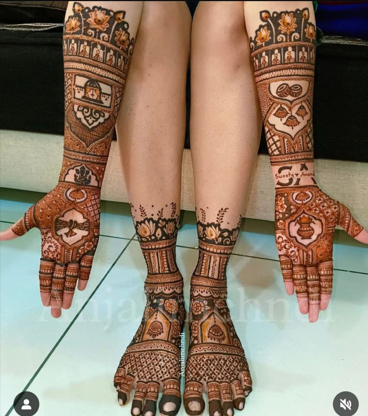 the legs and feet of a woman with henna tattoos