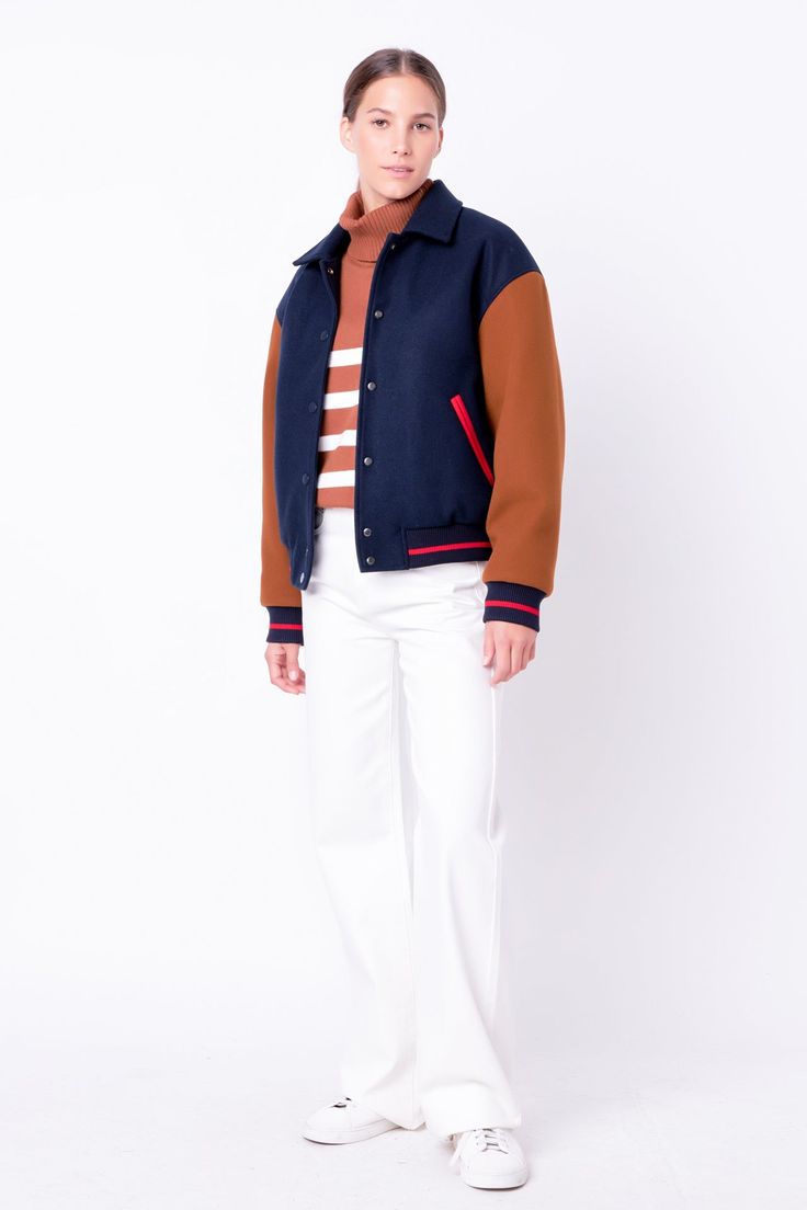 This Colorblock Bomber Jacket is a must-have item in every wardrobe. Showcasing contrast long sleeves a classic collar and front snap closure this modern jacket also features stylish side welt pockets. Crafted from quality material this jacket is perfect for a stylish on-trend look. Get the perfect fit and show off your unique style when you adorn this Colorblock Bomber Jacket. Collar Contrast long sleeves Front snap button closure Side welt pockets Ribbed Lined Hand wash cold Do not bleach Do n Varsity Style Long Sleeve Outerwear With Contrast Color, Color Block Long Sleeve Varsity Jacket, Fall College Color Block Outerwear, Color Block Varsity Jacket, Fall Streetwear Outerwear With Contrast Collar, Fall Track Jacket With Contrast Panels And Long Sleeves, Fall Outerwear With Contrast Collar For Streetwear, Varsity Jacket With Contrast Collar For Work, Varsity Outerwear With Button Closure For Work