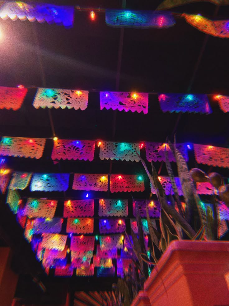 the ceiling is decorated with colorful lights