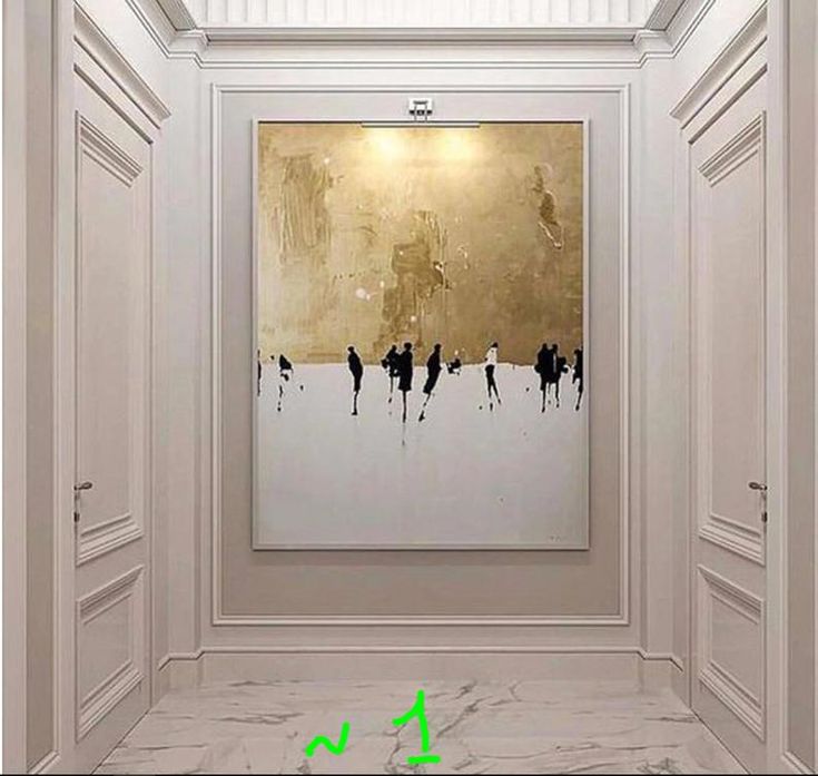 an empty room with paintings on the wall and marble flooring in front of it