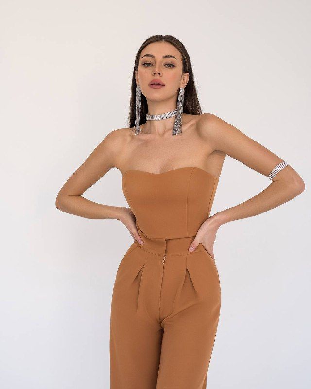 Fabric: Crepe Composition: cotton 65%, polyester 35% Included: jacket, corseted crop top, wide-leg pants and belt Wide-notched lapels High-rise pants Pants length (inseam): 95cm/ 37.5in Color: Black, White, Red, Camel Chic Two-piece Pantsuit For Night Out, Fitted Belted Strapless Jumpsuit, Fitted Cropped Wide Leg Pants For Work, Chic Belted Spring Sets, Chic Belted Sets For Spring, Fitted Two-piece Pantsuit For Party, Chic Two-piece Pantsuit For Party, Elegant High Waist Two-piece Bottoms Set, Strapless Wide Leg Jumpsuit For Date Night