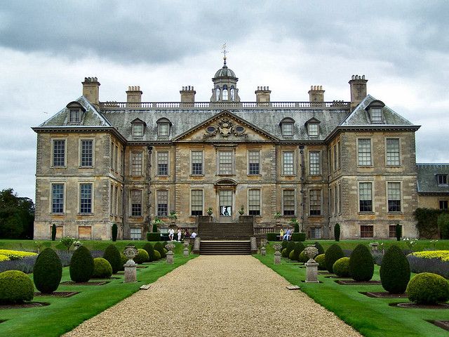 a large building with lots of trees in front of it