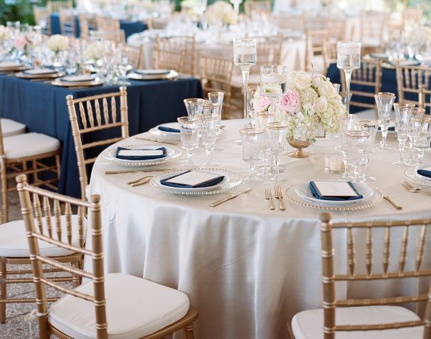 the tables are set with blue and white linens