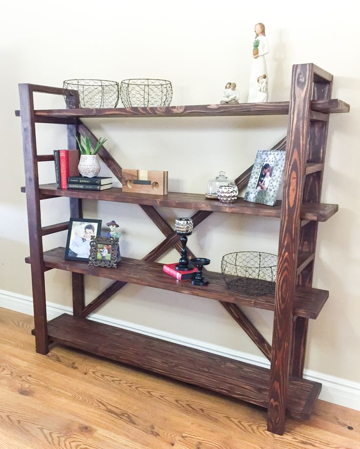 a wooden shelf sitting on top of a hard wood floor