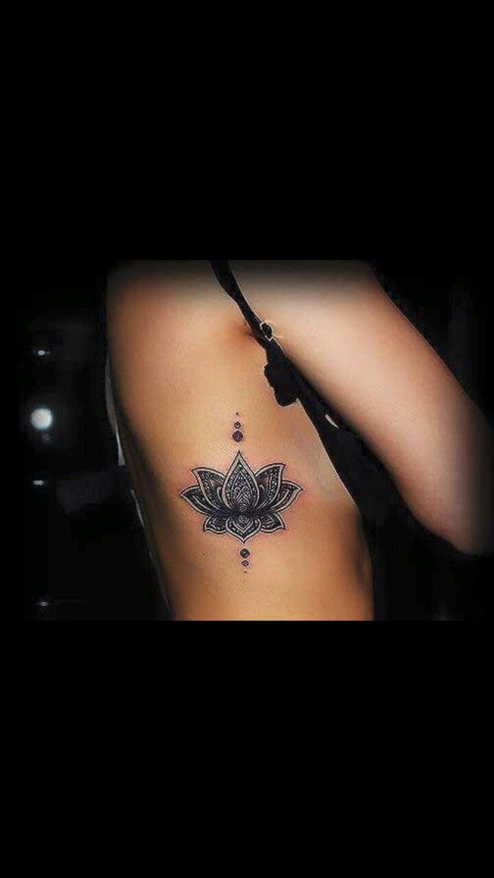 a woman with a lotus tattoo on her back