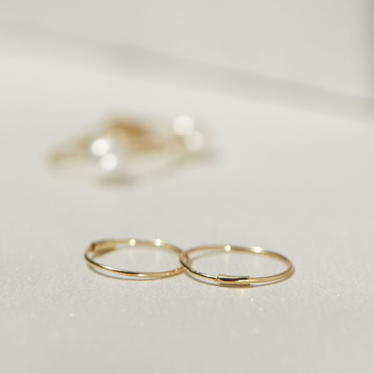 Filament Hoop, Yellow Gold Tiny Classic Midi Rings For Everyday, Classic Tiny Midi Rings For Everyday, Classic Tiny Hoop Earrings, Tiny Classic Hoop Earrings, Tiny Classic 14k Gold Hoop Earrings, 14k Gold Small Hoop Stackable Earrings, Simple Style Yellow Gold 14k Gold Filled Midi Rings, Minimalist Stackable Hoop Earrings, Small 14k Gold Stackable Hoop Earrings