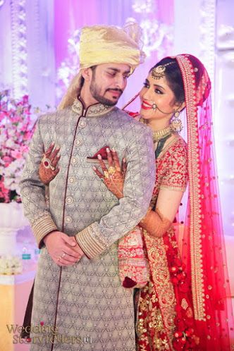 Wedding Storytellers "Portfolio" album - Candid Couple Shot - Bride in a Red Sequinned Lehenga and Groom in a Grey with Ornaments Suit. WeddingNet #weddingnet #indianwedding #indianbride #bride #bridal #sequinned #lehenga #bridallehenga #weddinglehenga #suit #green #gold #red शादी की तस्वीरें, Bride Groom Poses, Indian Bride Poses, Indian Bride Photography Poses, Wedding Posing, Indian Wedding Poses, Bride Photos Poses, Indian Wedding Bride, Indian Wedding Photography Couples