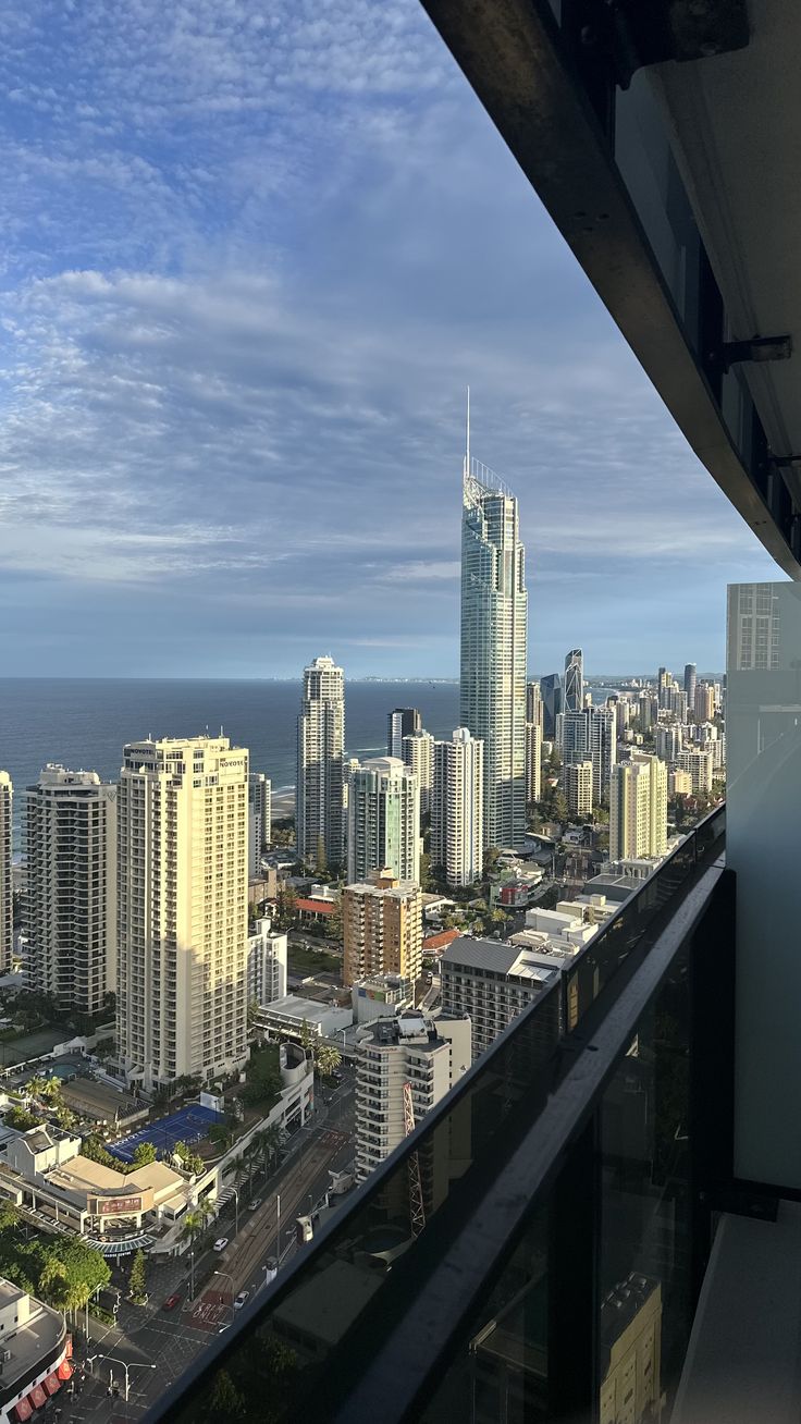 the city skyline is seen from an apartment balcony in surfers paradise, gold coast