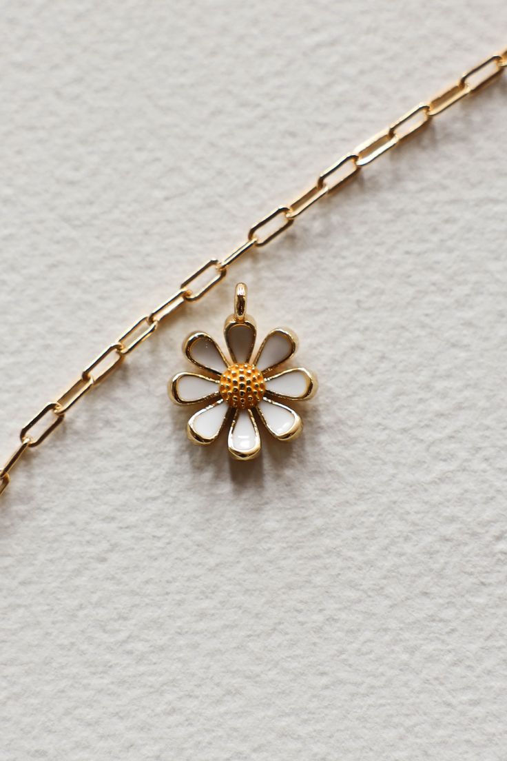 14k Gold filled enamel white daisy flower charm is sweet and happy. Add some joy to your charm necklace with this cute bloom. Hand make your custom charm necklace in Laguna Beach or build your piece online through adding a base necklace and your selection of charms. Leave us a note on your order for any special requests. 14K gold filled Tarnish resistant Enamel White Daisy Flower, Custom Charm Necklaces, Daisy Charm, Custom Charms, Ceramic Gifts, White Daisy, Candle Collection, Gift Card Sale, Flower Charm