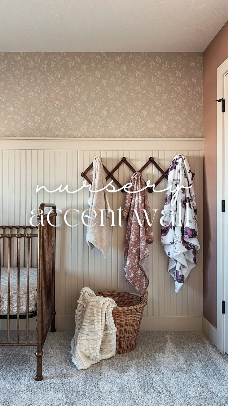 a baby's crib with blankets hanging on the wall