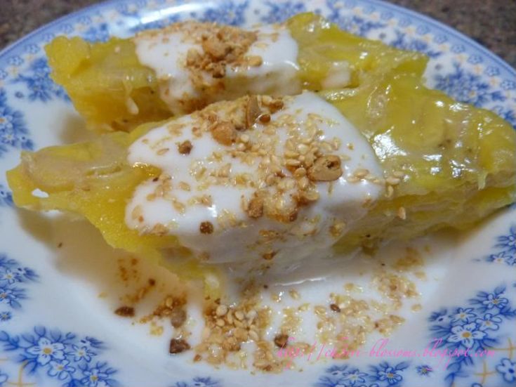 two pieces of dessert sitting on top of a blue and white plate with toppings