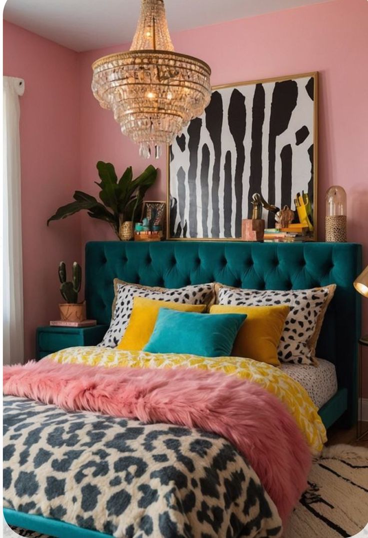 a bedroom decorated in pink, blue and yellow with a leopard print bed spread on the floor