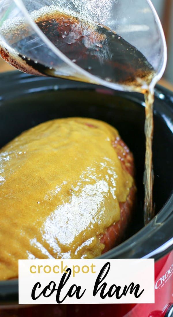 crockpot cola ham is being poured into the slow cooker