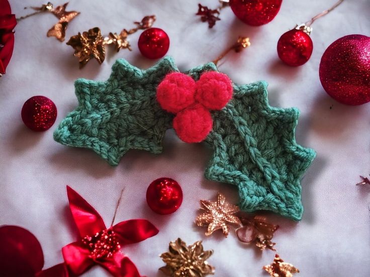 crocheted christmas decorations and ornaments on a table