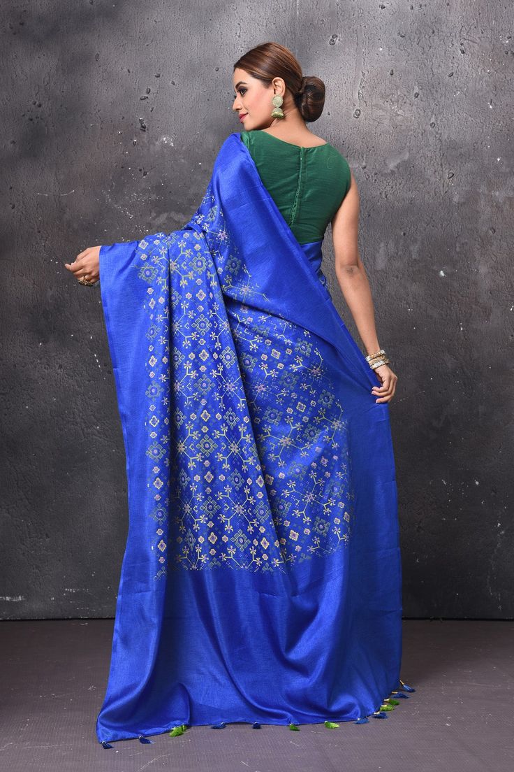 Radiate ethnic elegance on festive occasions in this royal blue printed patola saree. It comes with a matching blouse piece. Shop handloom sarees in USA from Pure Elegance. Disclaimer: The shown stitched blouse on the model is for display purpose only. The saree comes with a matching blouse piece and finished with fall and piko. Blue Slub Silk Traditional Wear For Festive Occasions, Festive Blue Slub Silk Traditional Wear, Festive Blue Tussar Silk Pre-draped Saree, Blue Festive Slub Silk Traditional Wear, Blue Chanderi Pre-draped Saree With Motifs, Festive Blue Art Silk Pre-draped Saree, Blue Art Silk Pre-draped Saree With Traditional Patterns, Transitional Blue Silk Pre-draped Saree, Transitional Blue Pre-draped Saree With Unstitched Blouse