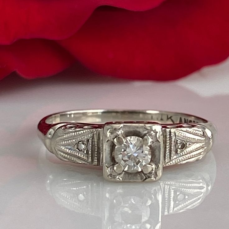 Details: Sweet classic Art Deco diamond ring--this one would make a great engagement ring or just a sweet ring to add to a collection. Would also be a great pinky ring! Please ask all necessary questions prior to placing an order. Measurements: The size is 4 1/2 US, and can be sized for a fee. Condition: The overall all condition of this ring is very good. Heirloom Diamond Cut Cluster Ring For Promise Occasion, Heirloom Diamond White Cluster Promise Ring, 14k White Gold Emerald Cut Promise Diamond Ring, Emerald Cut 14k White Gold Diamond Promise Ring, Heirloom Style Promise Ring With Diamond Accents, Heirloom Promise Ring With Diamond Accents, Elegant Promise Ring With Center Stone Birthstone, Elegant Birthstone Ring With Center Stone For Promise, Elegant Promise Birthstone Ring With Center Stone