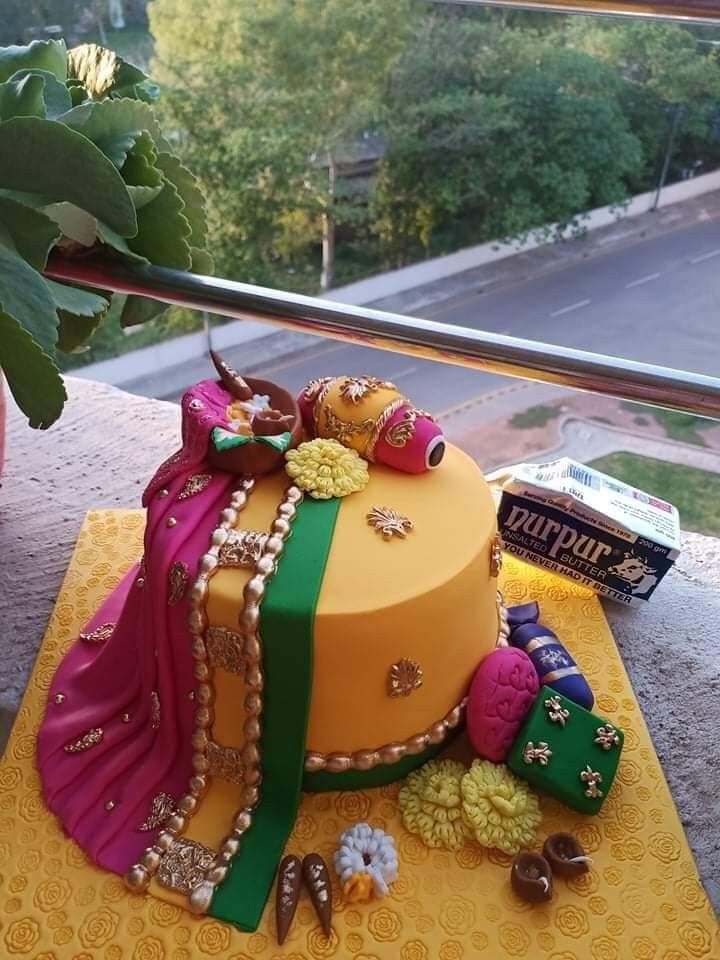 a decorated cake sitting on top of a table