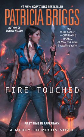 the cover to fire touched by mery thomasson, featuring an image of a woman holding