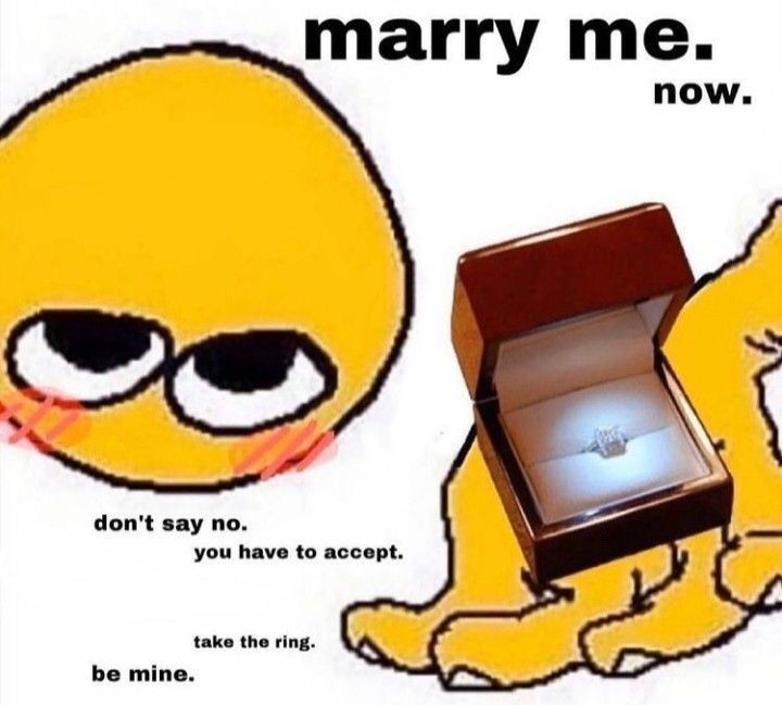 an open box with a ring in it sitting next to a cartoon character's face