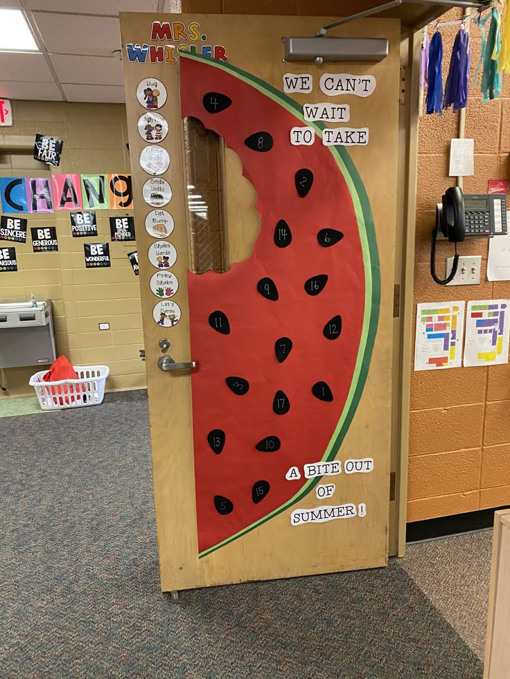 a classroom door decorated to look like a watermelon