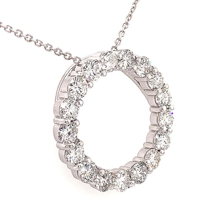 This is our magnificent Circle of Love pendant necklace in 14 kt white gold! This classic circle pendant has an amazing 7.00 ct. total weight of immaculately clean SI-1 clarity and brilliantly white F color diamonds set in a never ending circle on this pendant. A 16 inch cable link chain loops through the hidden bale of the pendant and this secures to the neck with a lobster claw closure. Anniversary Round Diamond Necklace With Prong Setting, Classic Round Diamond Necklace With Halo Design, 14k White Gold Necklace With Prong Setting, Classic White Diamond Necklace With Halo, Classic Circle Jewelry With Brilliant Cut, Anniversary Diamond Necklace With Round Prong Setting, 14k White Gold Necklace With Vvs Clarity, Round Diamond Necklace With Halo Setting For Anniversary, Anniversary White Gold Halo Diamond Necklace