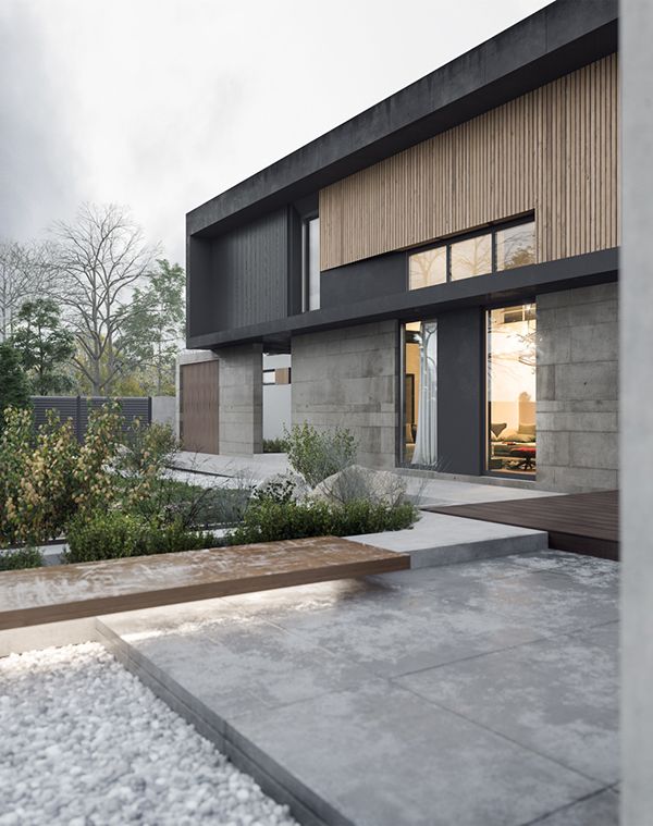 a modern house with stone steps leading to the front door