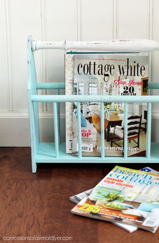 a magazine rack sitting on top of a wooden floor