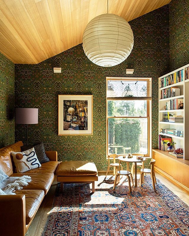 a living room filled with furniture and a large rug